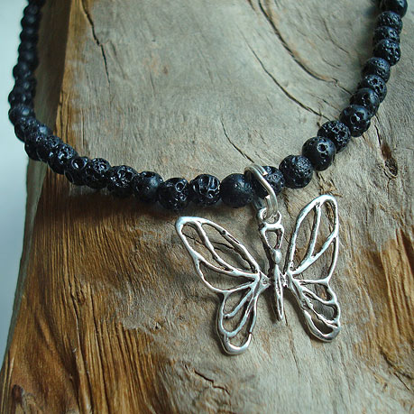 Butterfly in sterling silver on a lava stone necklace