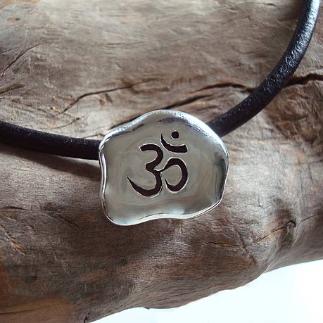 Om Sign in sterling silver on a leather band
