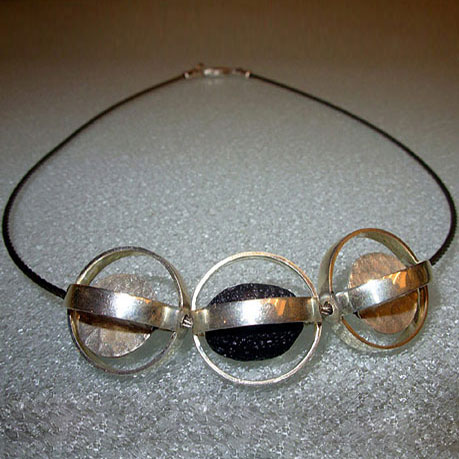 Necklace in sterling silver and lava stones on a stainless steel wire